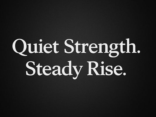  A minimalist dark gradient background with soft light and the words ‘Quiet Strength. Steady Rise.’ representing discipline, momentum, and quiet growth.