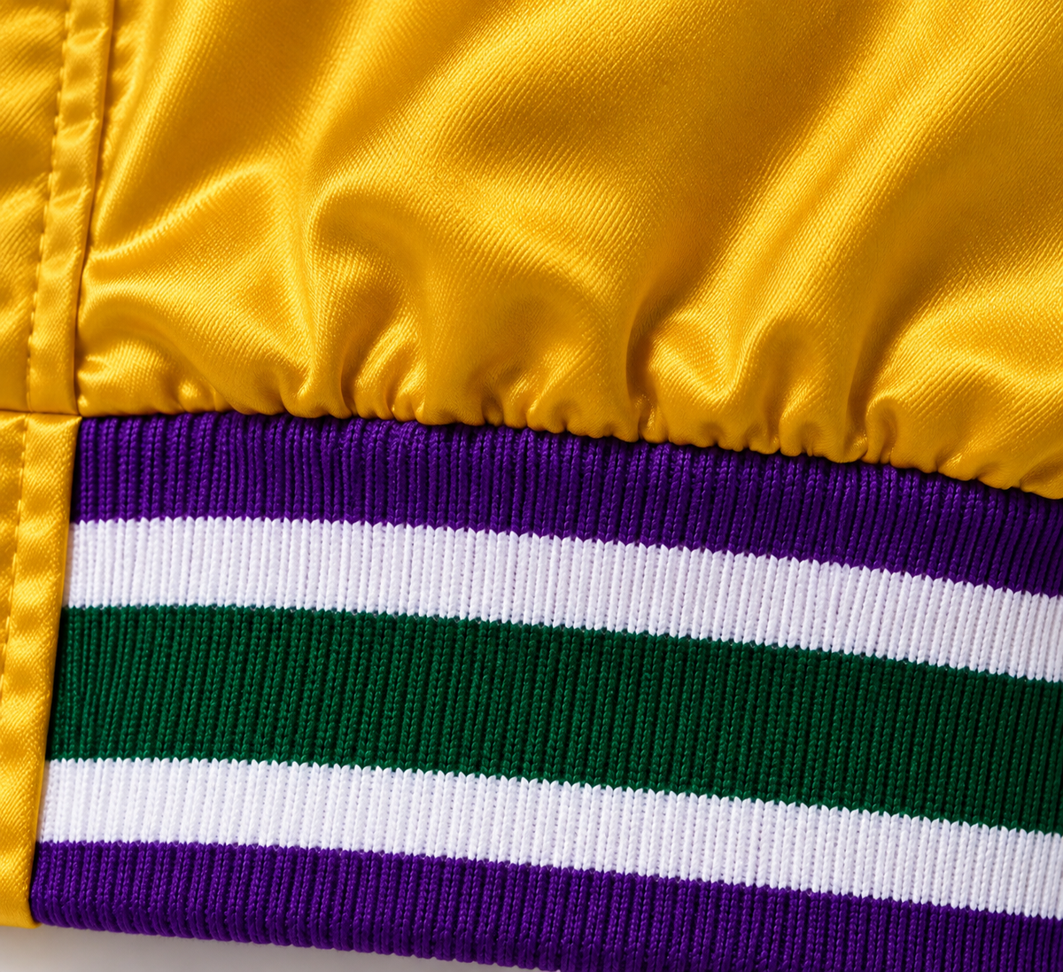 Multicolored rib-knit band meeting the MG27 satin body.
