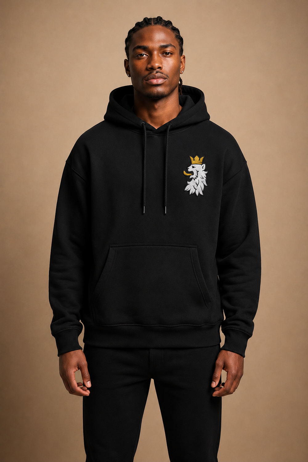 Model wering the Leão Branco Motif Hoodie in black, showcasing the relaxed fit, heavyweight construction, and embroidered Leão Branco Motif.