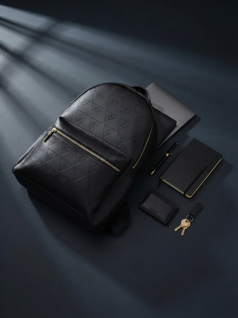 Editorial flat lay showing thoughtfully organized backpack essentials, demonstrating how intentional packing supports everyday movement, work, and travel.