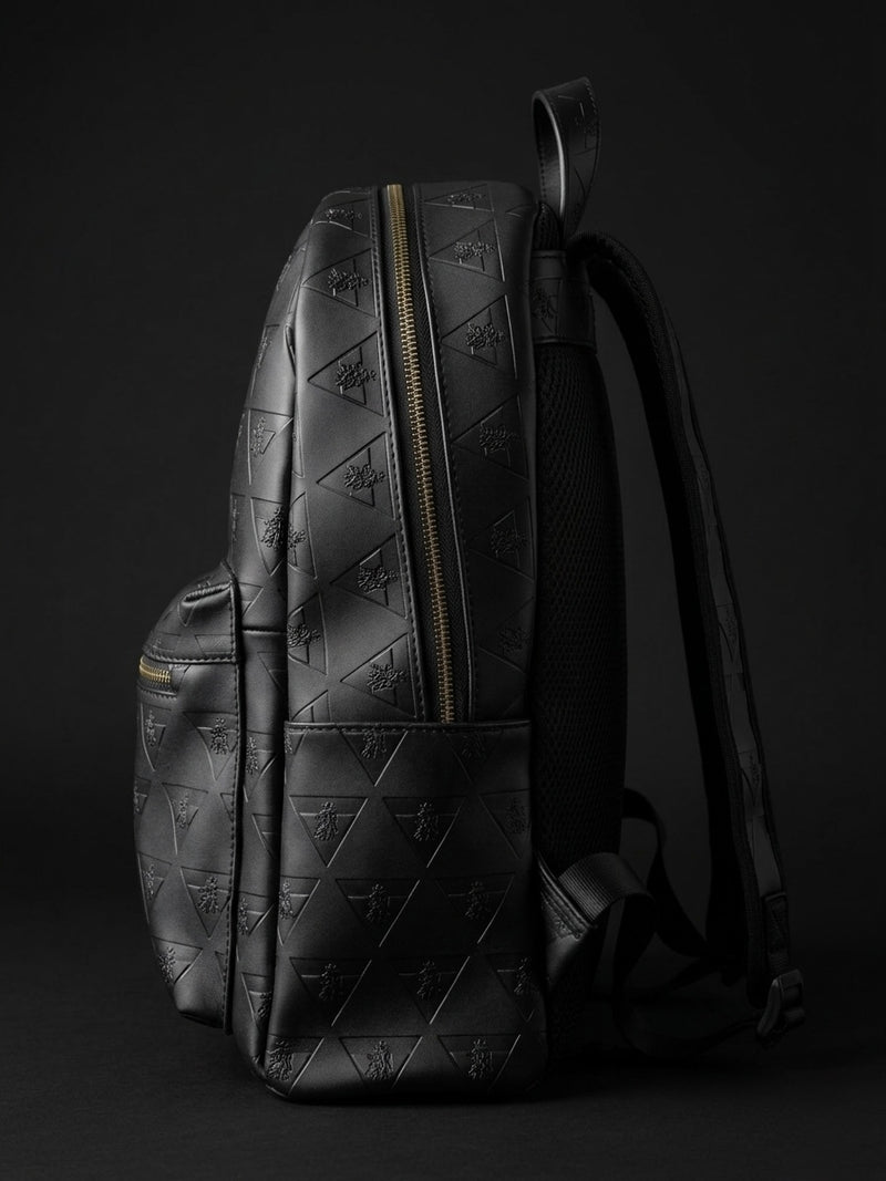 Side profile of structured full grain leather backpack showing depth and refined shape