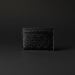 Full grain leather card holder detail showing natural leather character and refined construction