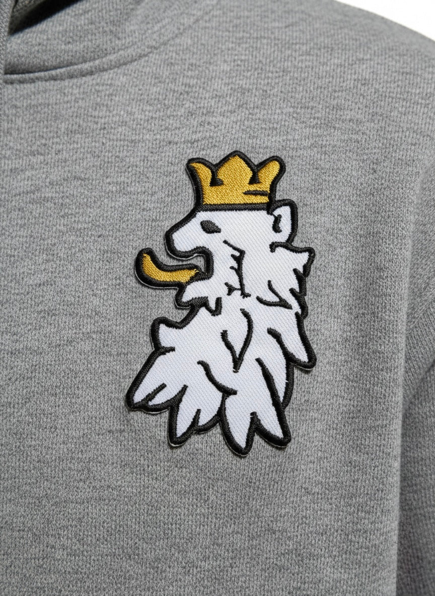 White and gold lion embroidery detail on Leão Branco premium hoodie