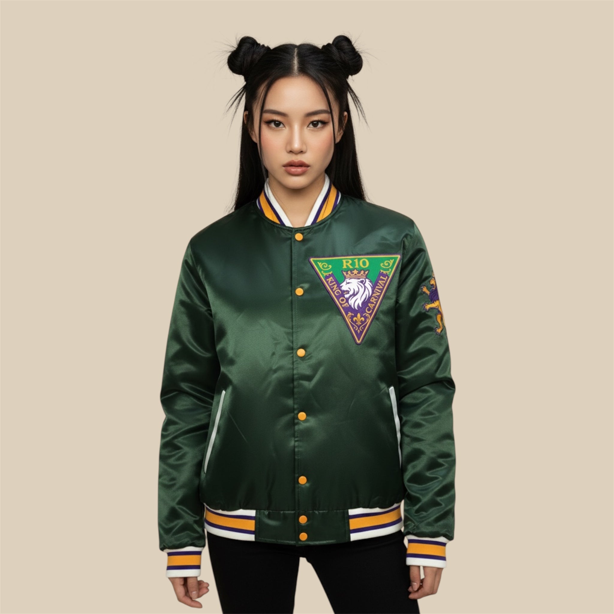 Front view of R10 MG26 Esmeralda Oscura satin bomber jacket on female model, showcasing embroidered crest, ribbed collar, and tailored fit.