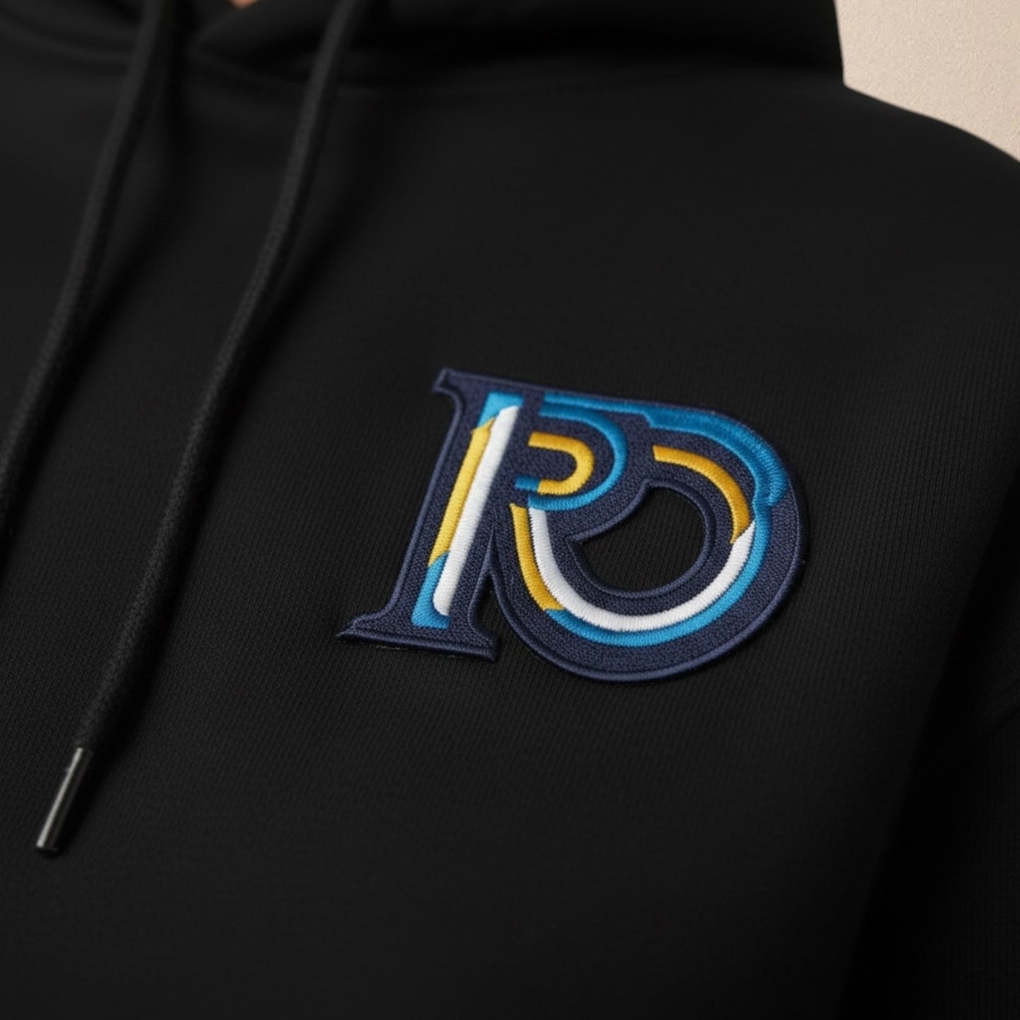 R10 black hoodie Monogram embroidery detail