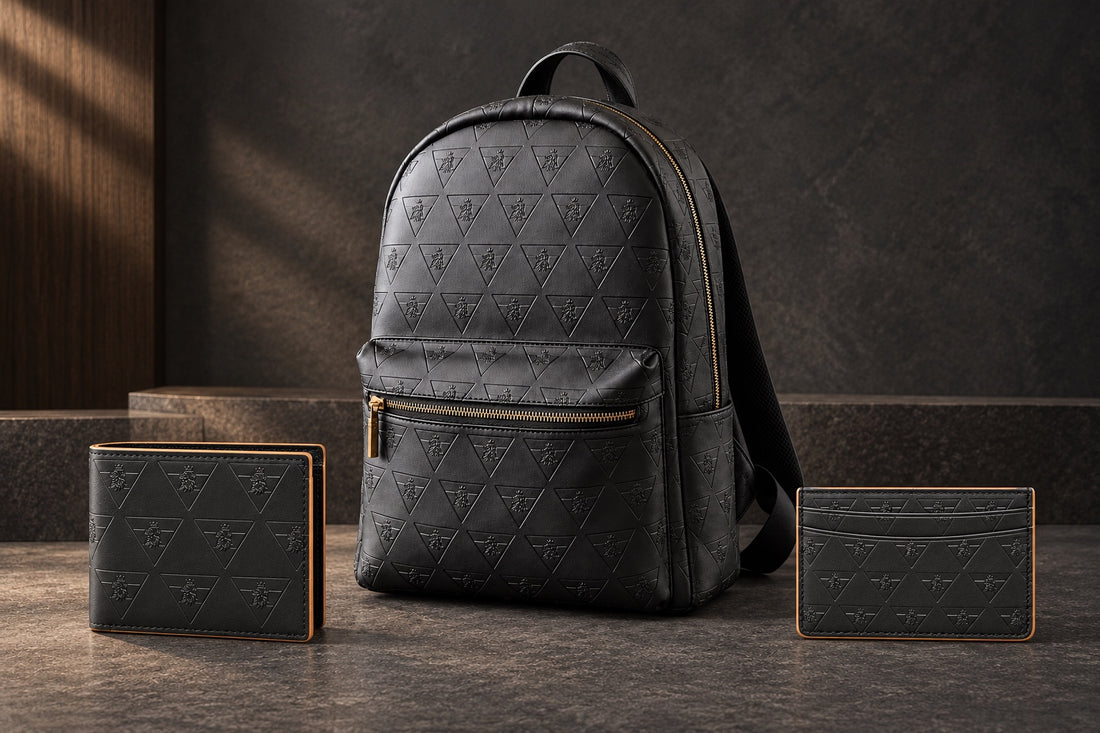 R10 Leather Division backpack, bifold wallet, and cardholder displayed together on dark stone.