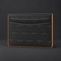 Angled view of the empty black R10 cardholder, showing its card slots and finished side edge.