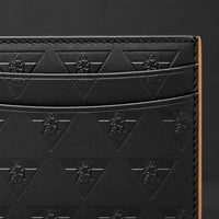 Close-up of the R10 cardholder’s embossed leather, layered card slots, and stitched side edge.