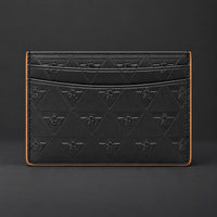Front view of the black R10 Leão Branco cardholder, showing embossed motifs, card slots, and stitched edges.