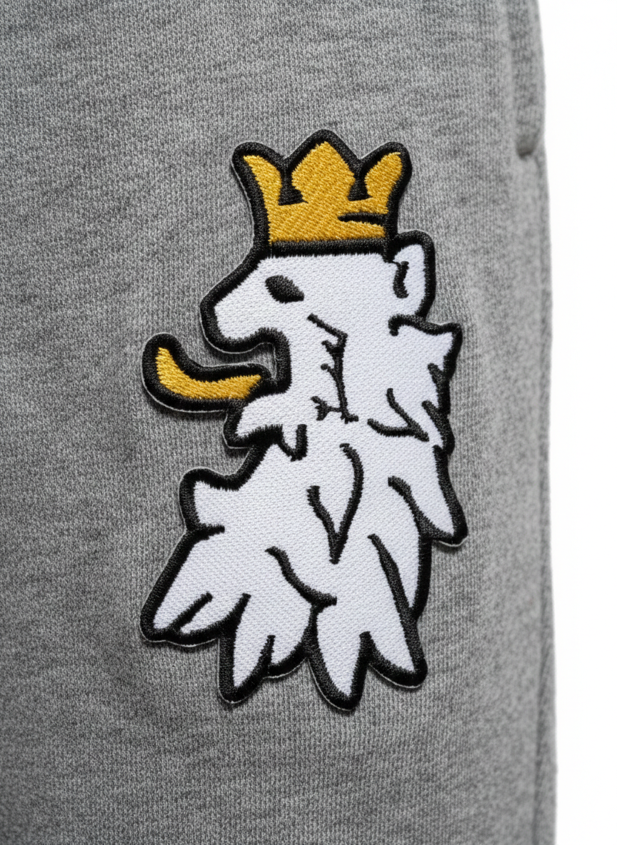 R10 graphite heather joggers close up Leão Branco motif detail