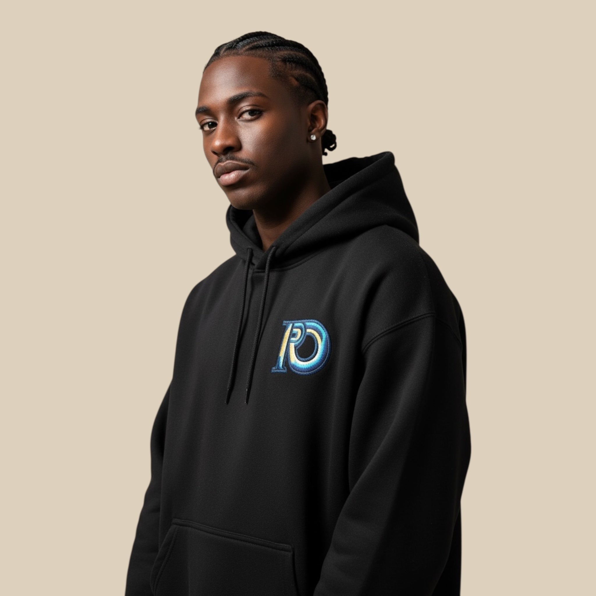 Male model wearing the R10 Monogram Premium Hoodie in black, embodying quiet luxury and disciplined presence.