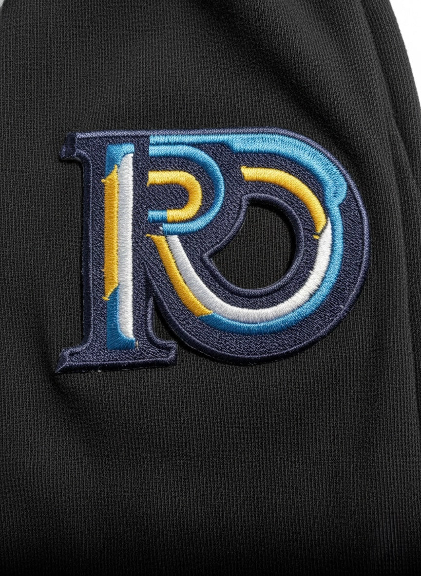R10 black joggers close up Monogram emblem detail