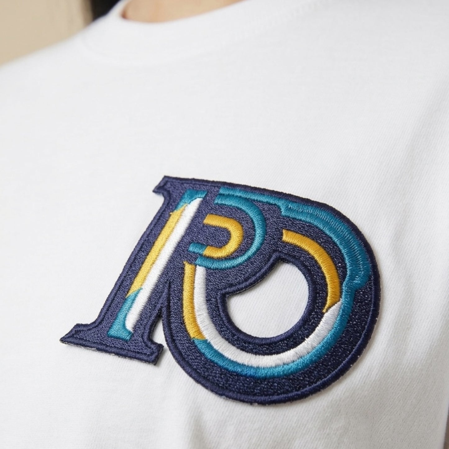 R10 white tee Monogram embroidery detail