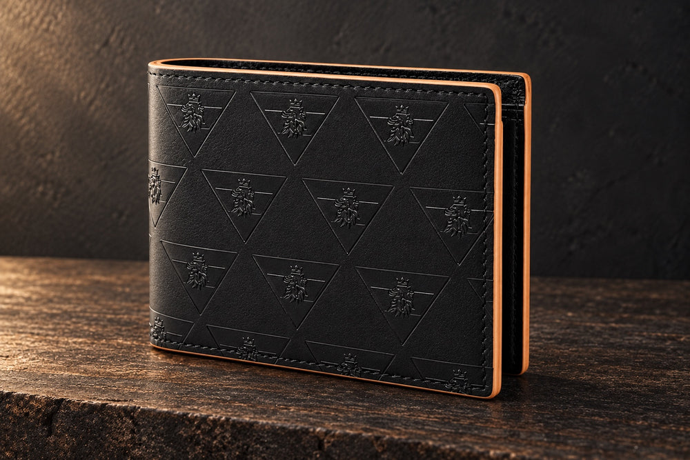 Closed R10 Leão Branco wallet on dark timber, showing its embossed exterior, fold, stitching, and contrasting edges.