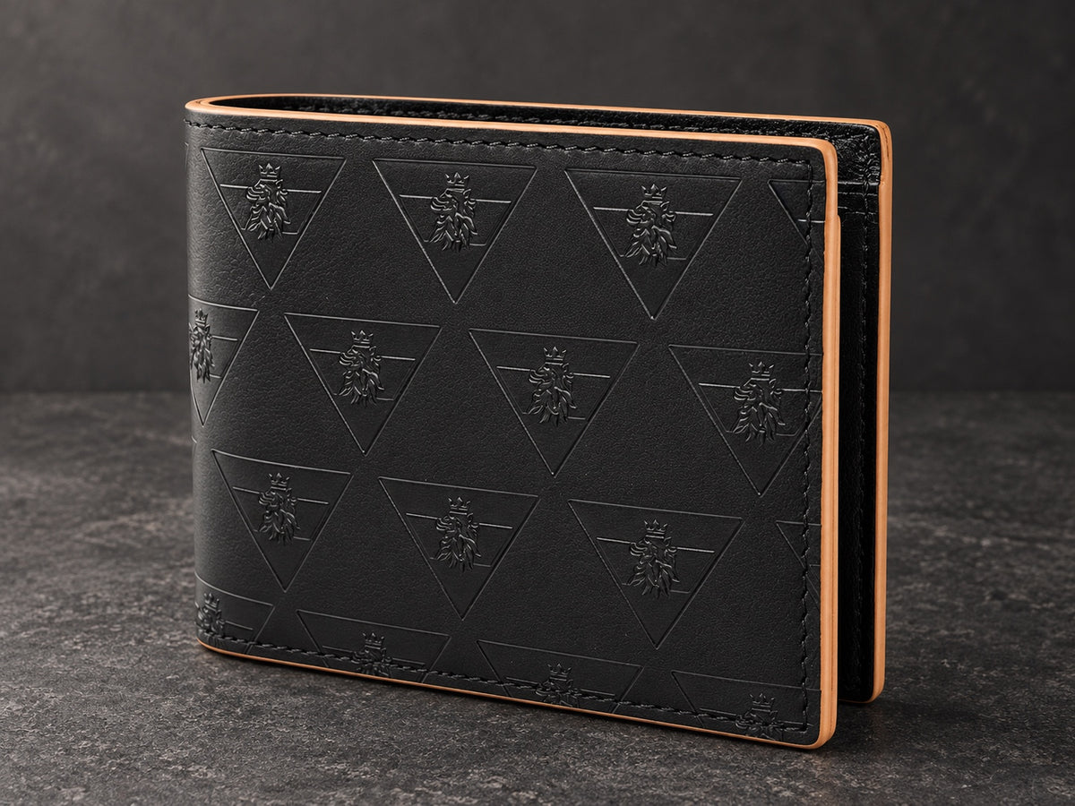 Three-quarter view of the R10 wallet on dark stone, showing its fold, embossed leather, stitching, and finished edges.